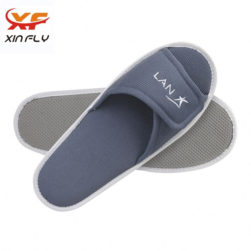 Zapatillas de hotel spa con suela EVA al por mayor con logotipo